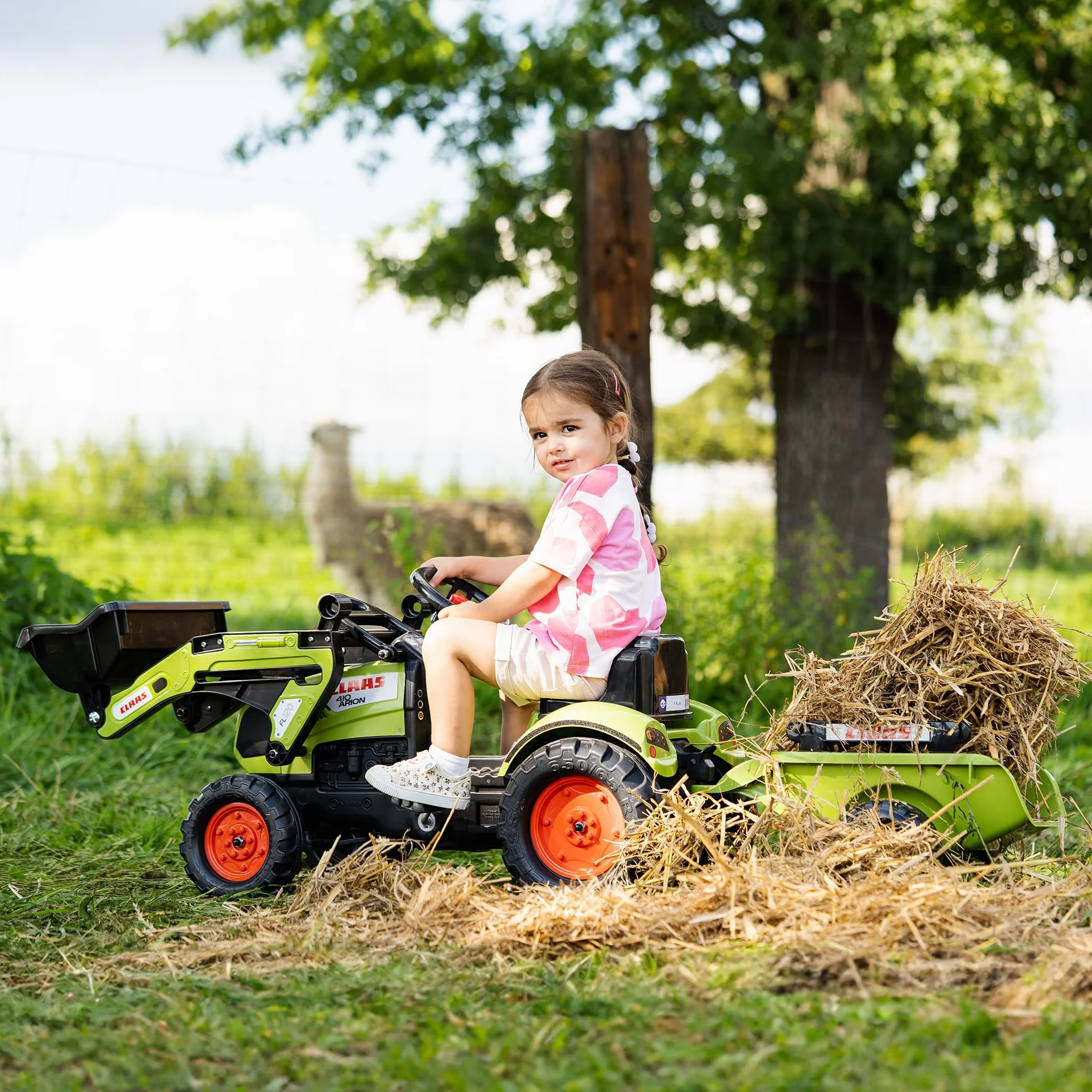 CLAAS Tractopelle Arion 410 avec remorque